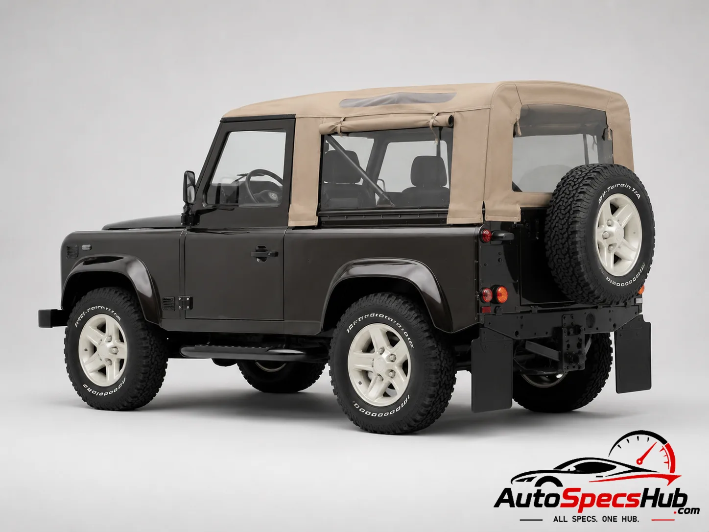 2000 Land Rover Defender 90 Td5 Soft Top rear three-quarter view